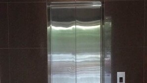 A modern elevator with a metallic finish and a control panel on the wall. - Ayer Hitam Hotel (Ayer Hitam)