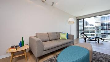 Apartment, 1 Bedroom (Aurora 14) | Living area | Flat-screen TV, DVD player