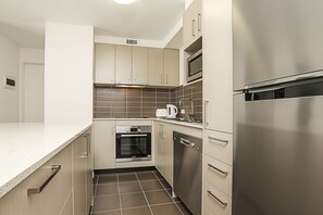 Apartment, 1 Bedroom (Braddon 13) | Private kitchen | Full-sized fridge, microwave, oven, stovetop - Accommodate Canberra - Braddon 33 (Braddon)