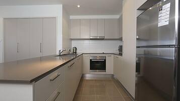 Apartment, 1 Bedroom (Aspire 45) | Private kitchen | Full-sized fridge, microwave, oven, stovetop