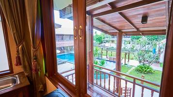 Family Suite, 1 Bedroom, Pool View, Garden Area | Bathroom | Shower, free toiletries, hair dryer, bathrobes