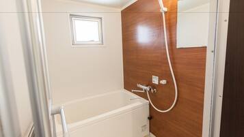 Apartment | Bathroom | Separate tub and shower, free toiletries, hair dryer, slippers