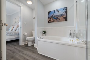 Bathtub, hair dryer, towels, soap