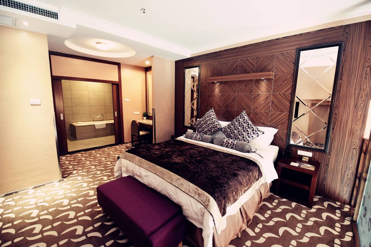 Luxury Loft, 1 Bedroom, Mezzanine | Down comforters, minibar, desk, blackout drapes