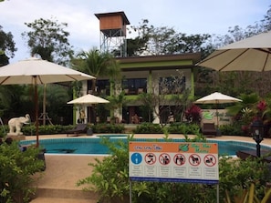 A pool area with a sign indicating 'Bai Bai Home' and a list of rules. - Bai Bai Home (Takua Pa)
