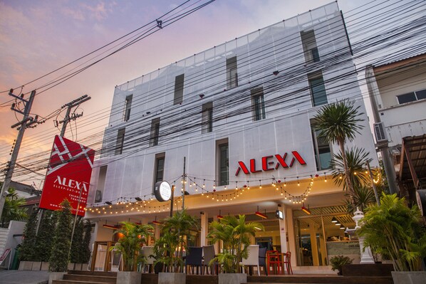 A building with the sign "ALEXA" and a large red sign for "ALEXA Sleep & Relaxation Bangkok".