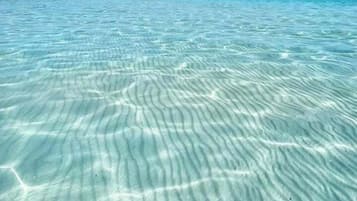 Una playa cerca, arena blanca, traslado desde/hacia la playa