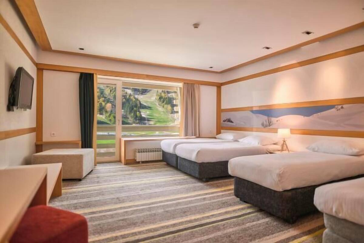 Premium bedding, desk, laptop workspace, free WiFi