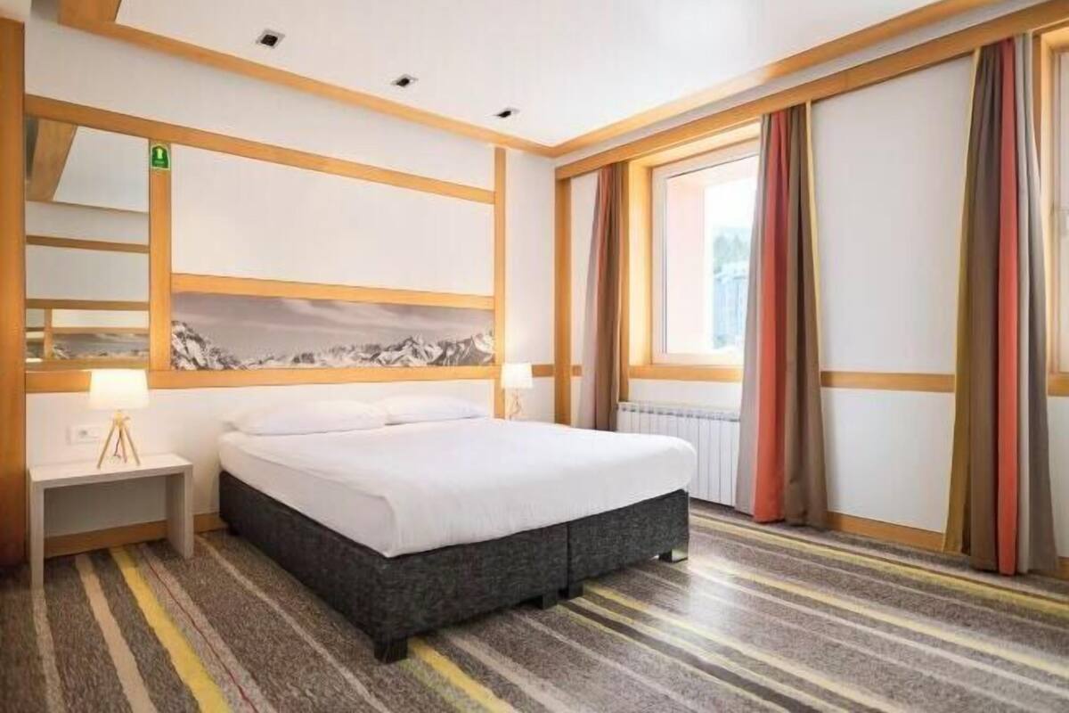 Premium bedding, desk, laptop workspace, free WiFi