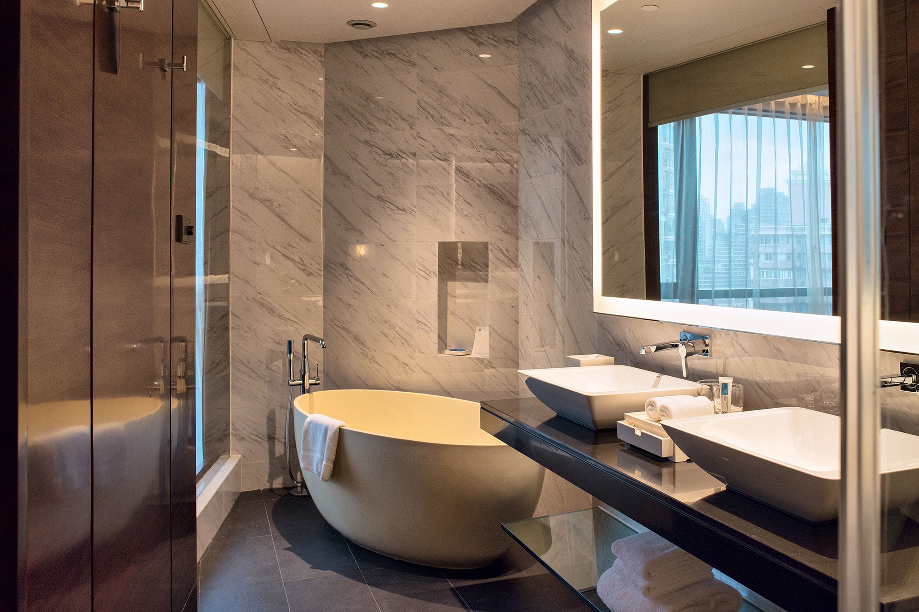 premium bedding, down duvets, tempur-pedic beds, in-room safe