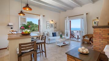 Villa, Sea View (Thalassa) | Living area | Flat-screen TV