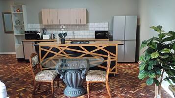 Standard Apartment | Living area | 40-inch Smart TV with digital channels, TV, books