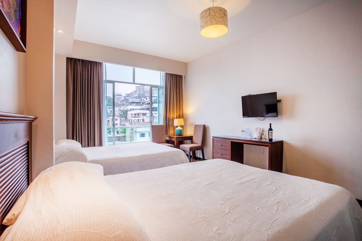 twin room with private bathroom | 1 bedroom, pillow-top beds, in-room safe, desk