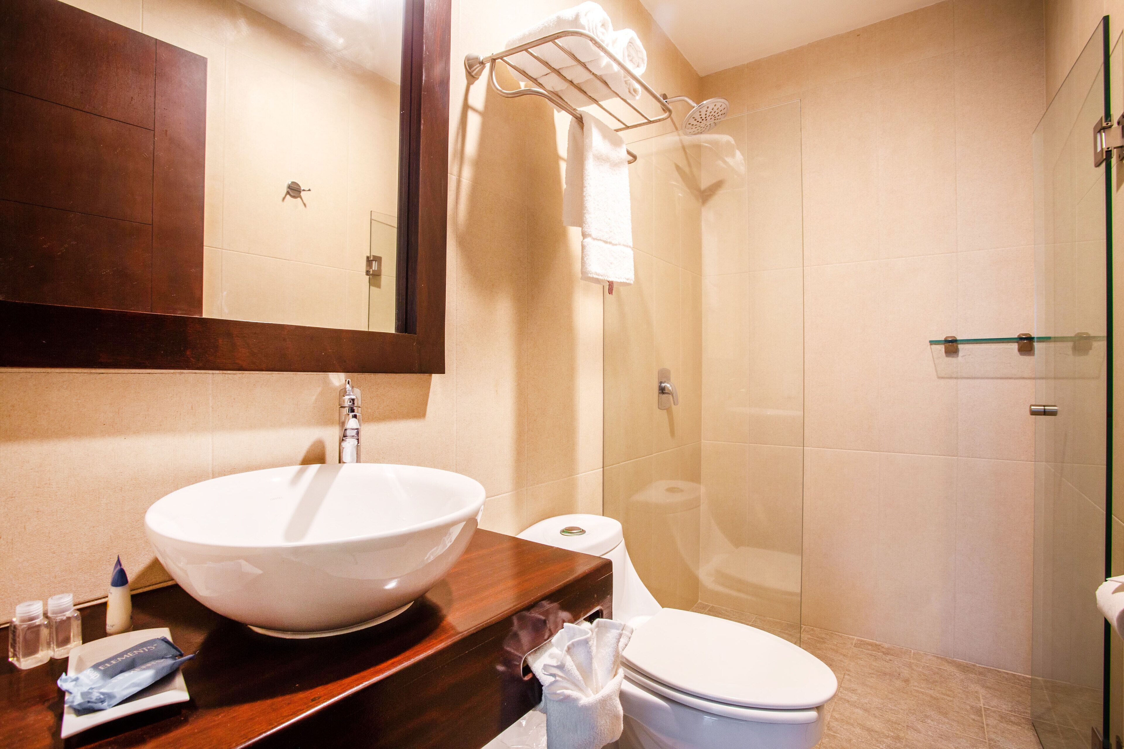 superior suite | bathroom | shower, free toiletries, hair dryer, towels