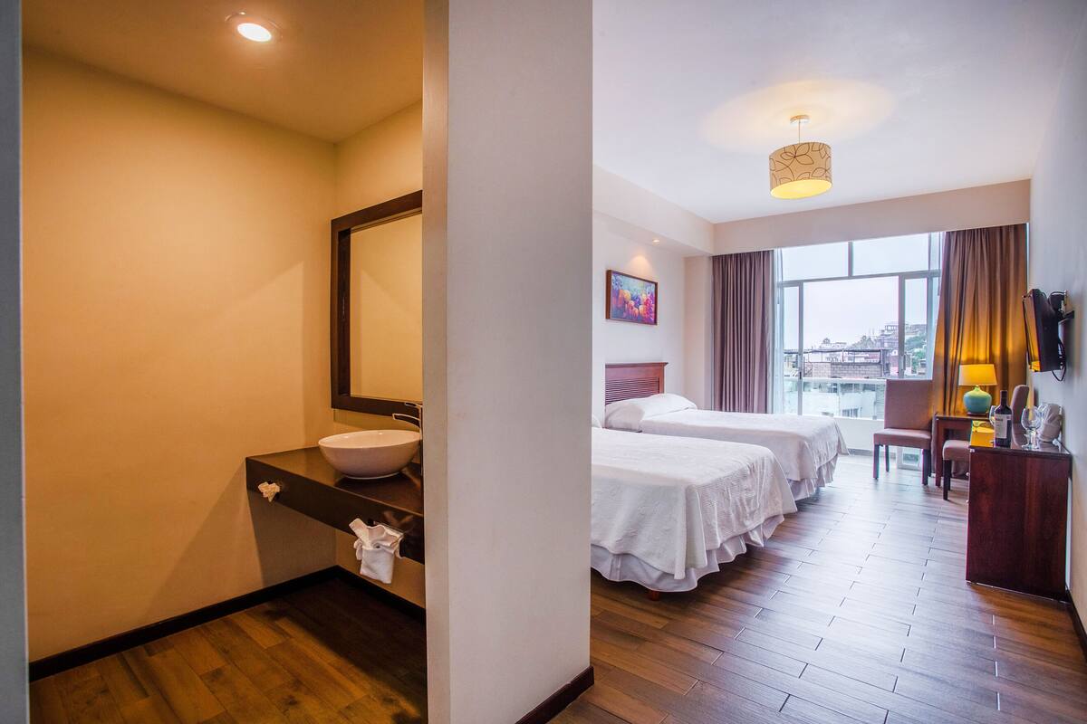 twin room with private bathroom | 1 bedroom, pillow-top beds, in-room safe, desk
