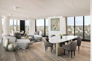 Suite, 2 Bedrooms | Living area | 55-inch TV with cable channels, Netflix, pay movies