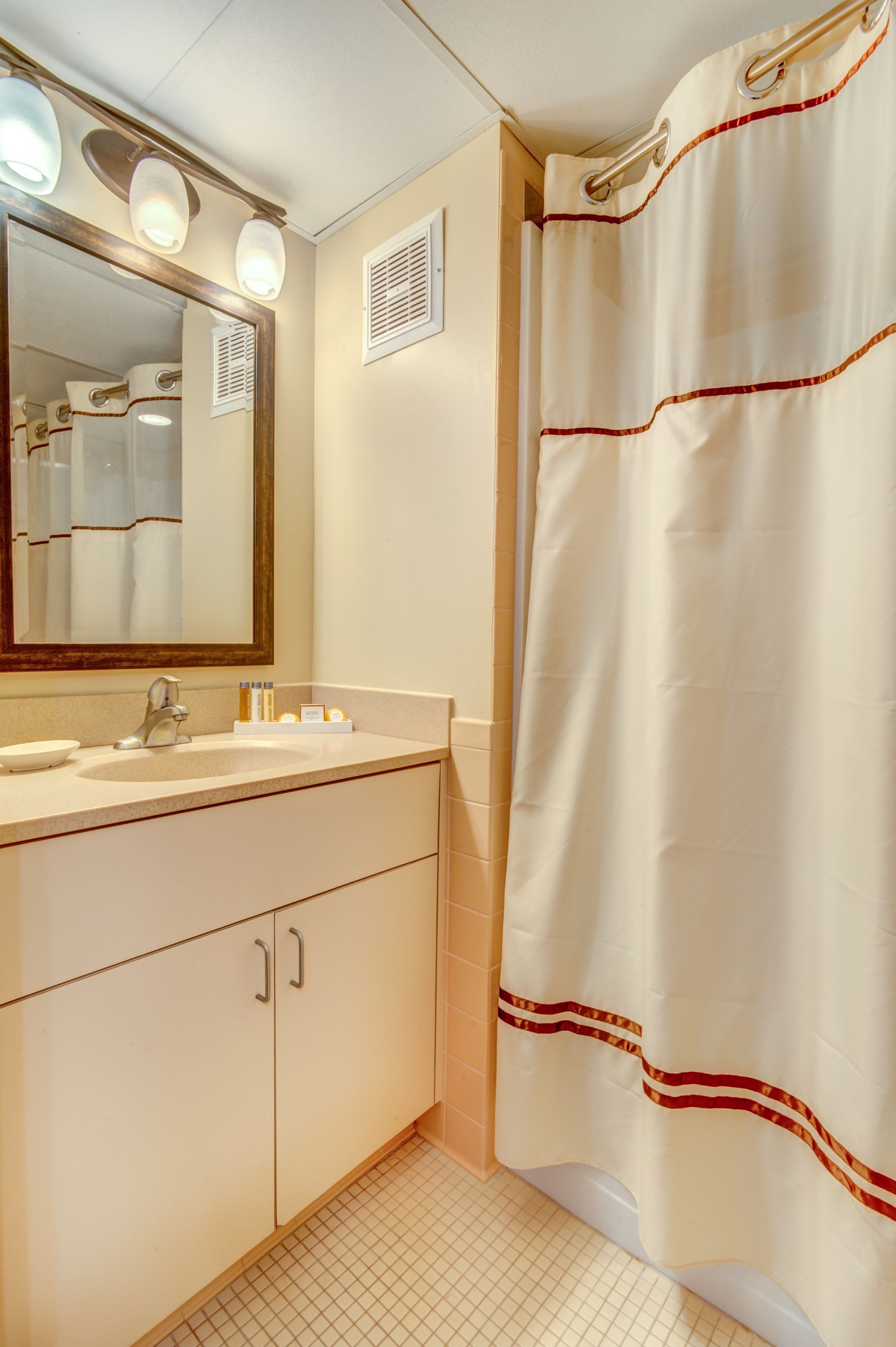 deluxe room, multiple beds, kitchenette, ocean view | bathroom | combined shower/bathtub, free toiletries, hair dryer, towels