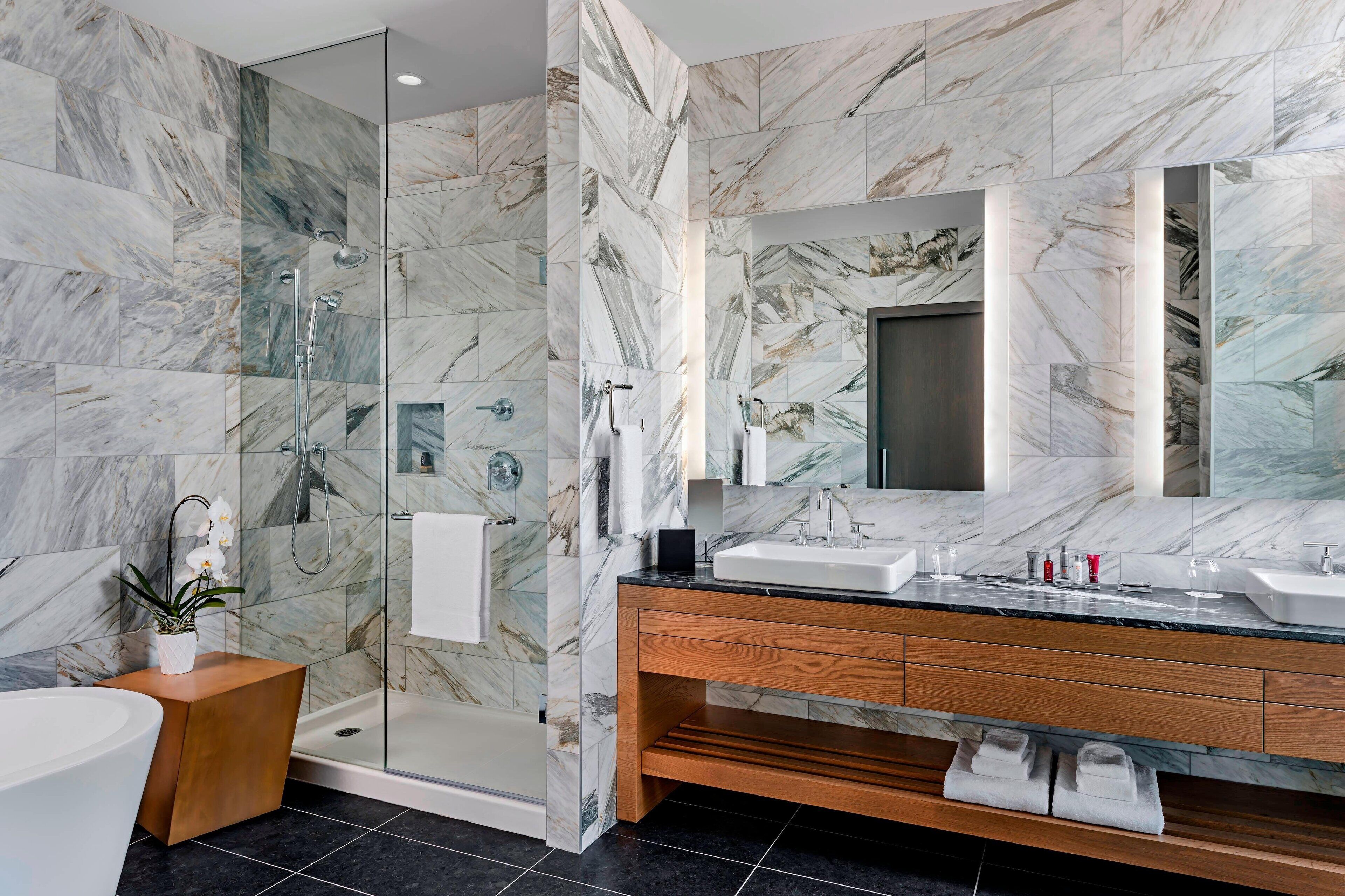 shower, designer toiletries, hair dryer, towels