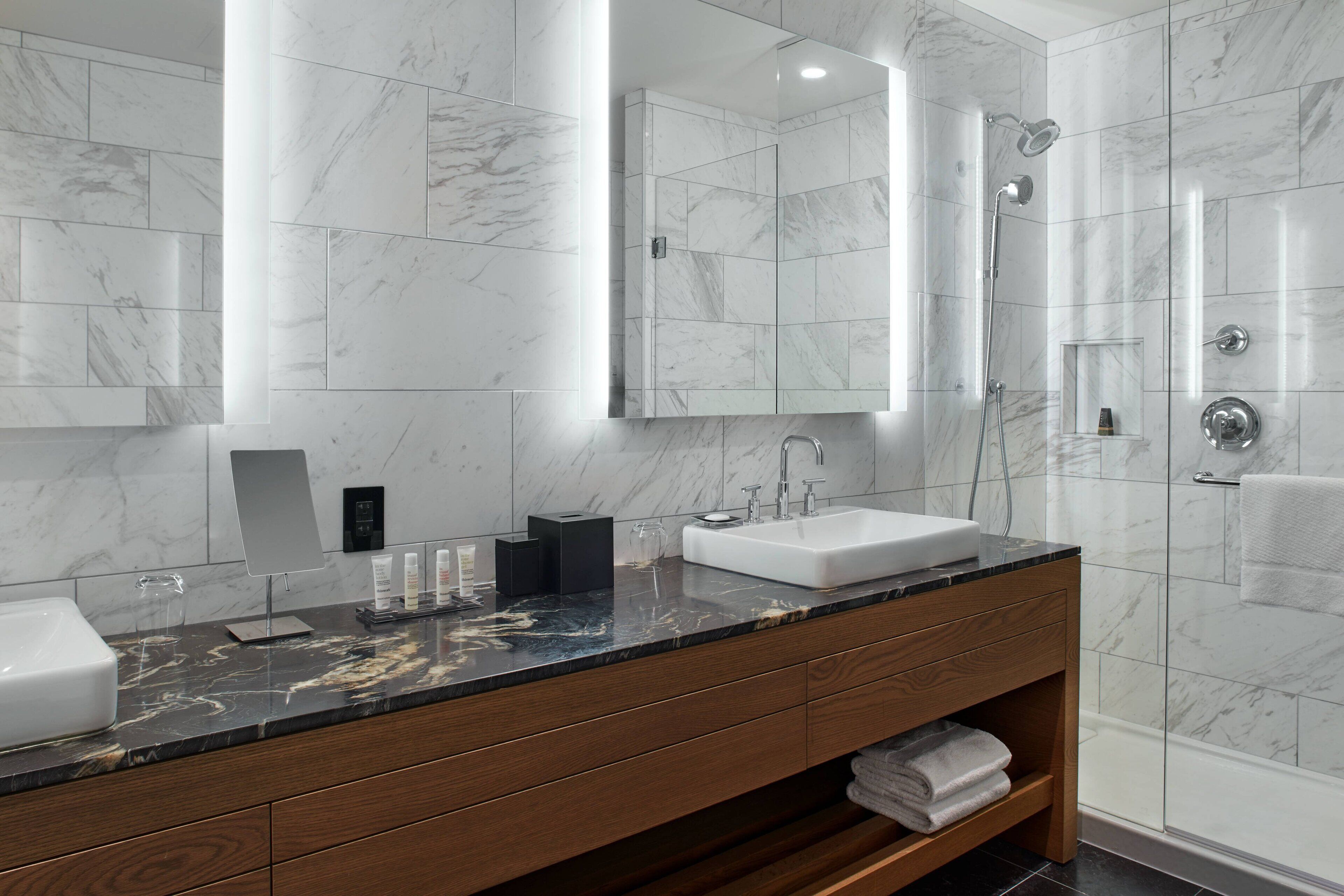 shower, designer toiletries, hair dryer, towels