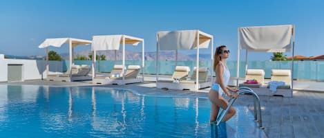 Seasonal outdoor pool, pool umbrellas, pool loungers