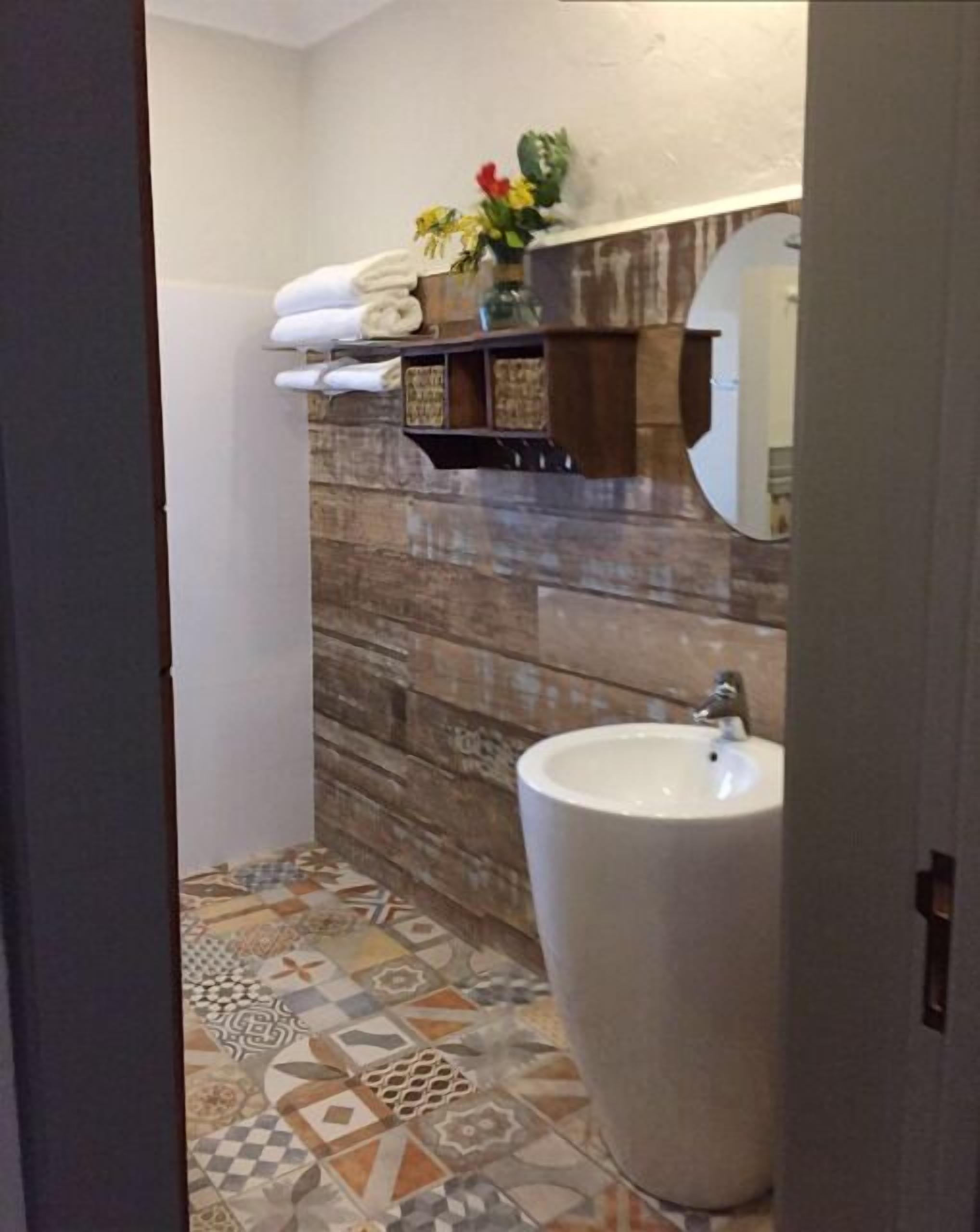 standard double or twin room | bathroom | shower, rainfall showerhead, hair dryer, slippers