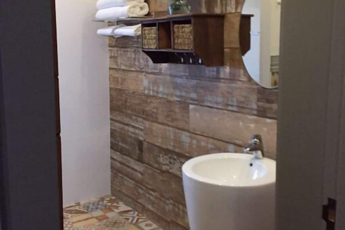 standard double or twin room | bathroom | shower, rainfall showerhead, hair dryer, slippers