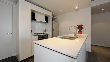 Apartment, 1 Queen Bed | Private kitchen | Fridge, microwave, stovetop, dishwasher