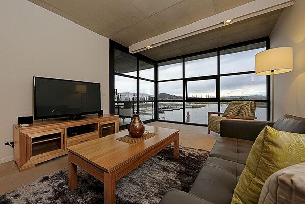 Apartment, 1 Bedroom | Living area | Flat-screen TV