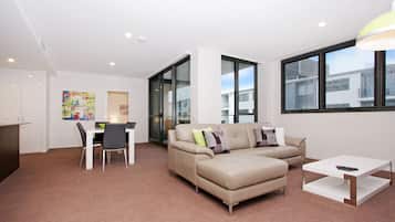 Apartment, 2 Bedrooms (602/51 Mort Street) | Living room | Flat-screen TV