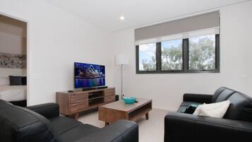 Apartment, 2 Bedrooms (507/104 Northbourne Avenue) | Living room | Flat-screen TV