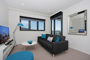 Apartment, 1 Bedroom (704/53 Mort Street) | Living area | Flat-screen TV - Accommodate Canberra - IQ - Braddon (Braddon)