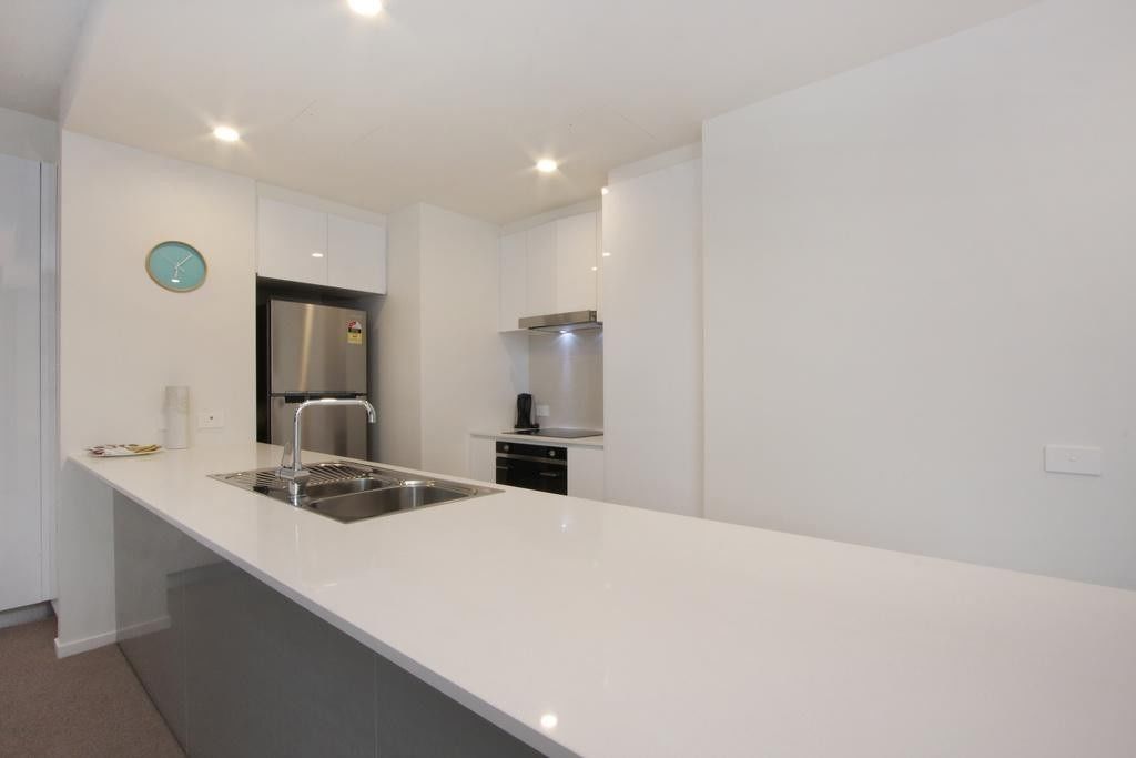 Apartment, 1 Bedroom (608/51 Mort Street) | Private kitchen | Full-sized fridge, microwave, oven, stovetop