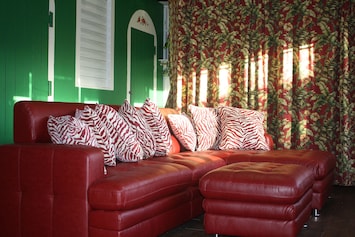 Living Room with TV, DVD and curtain separating second bedroom