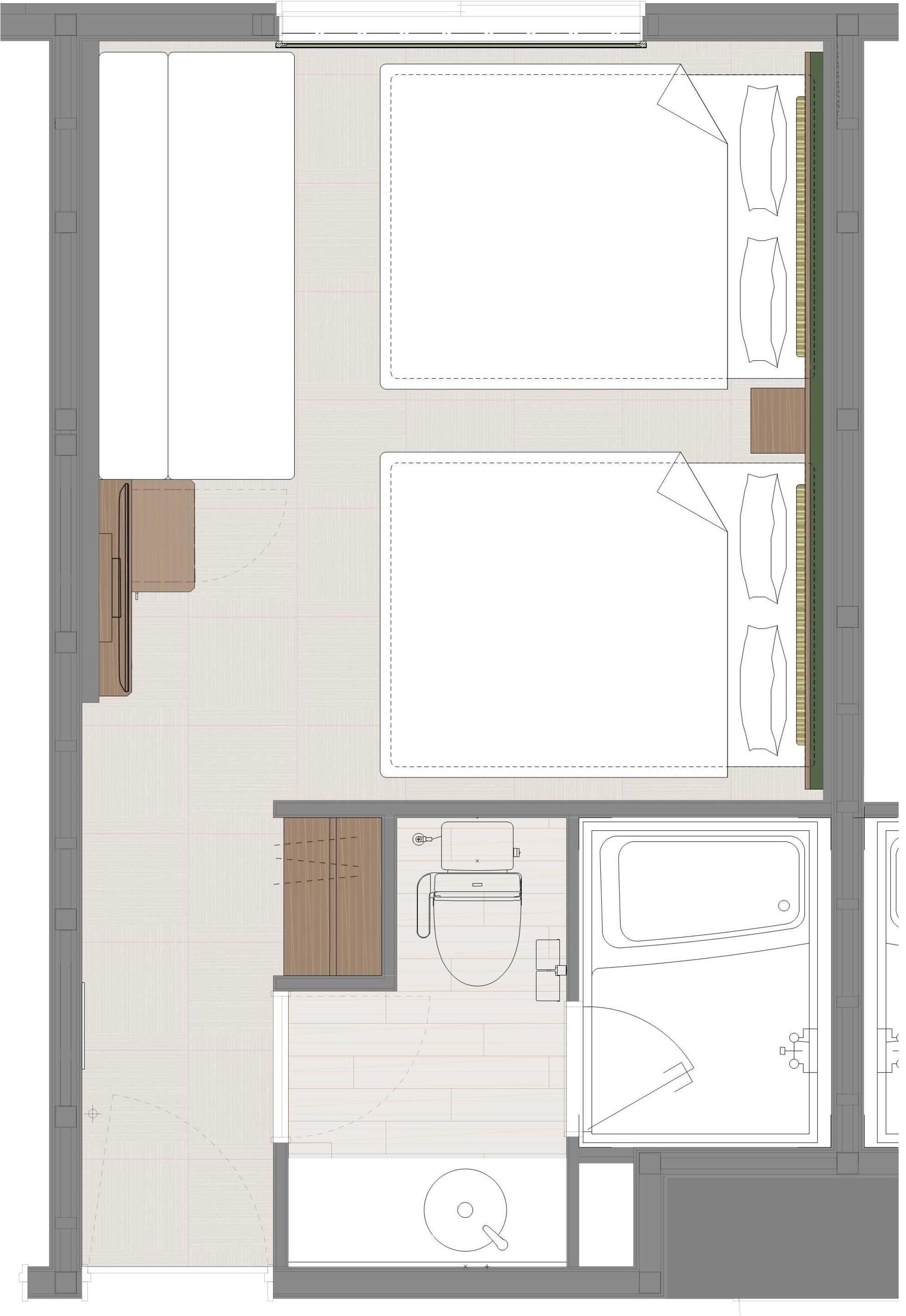 A floor plan of a hotel room with a bed, a sitting area, a bathroom, and a kitchenette.