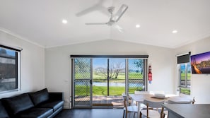 Deluxe Cabin | Living area | Flat-screen TV - Colac Colac Caravan Park (Colac Colac)