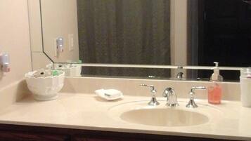 Combined shower/tub, hair dryer, towels, soap