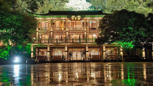 A traditional building with multiple floors, large windows, and a central entrance. - Guilin Crystal Crescent Moon Hotel (Guilin)
