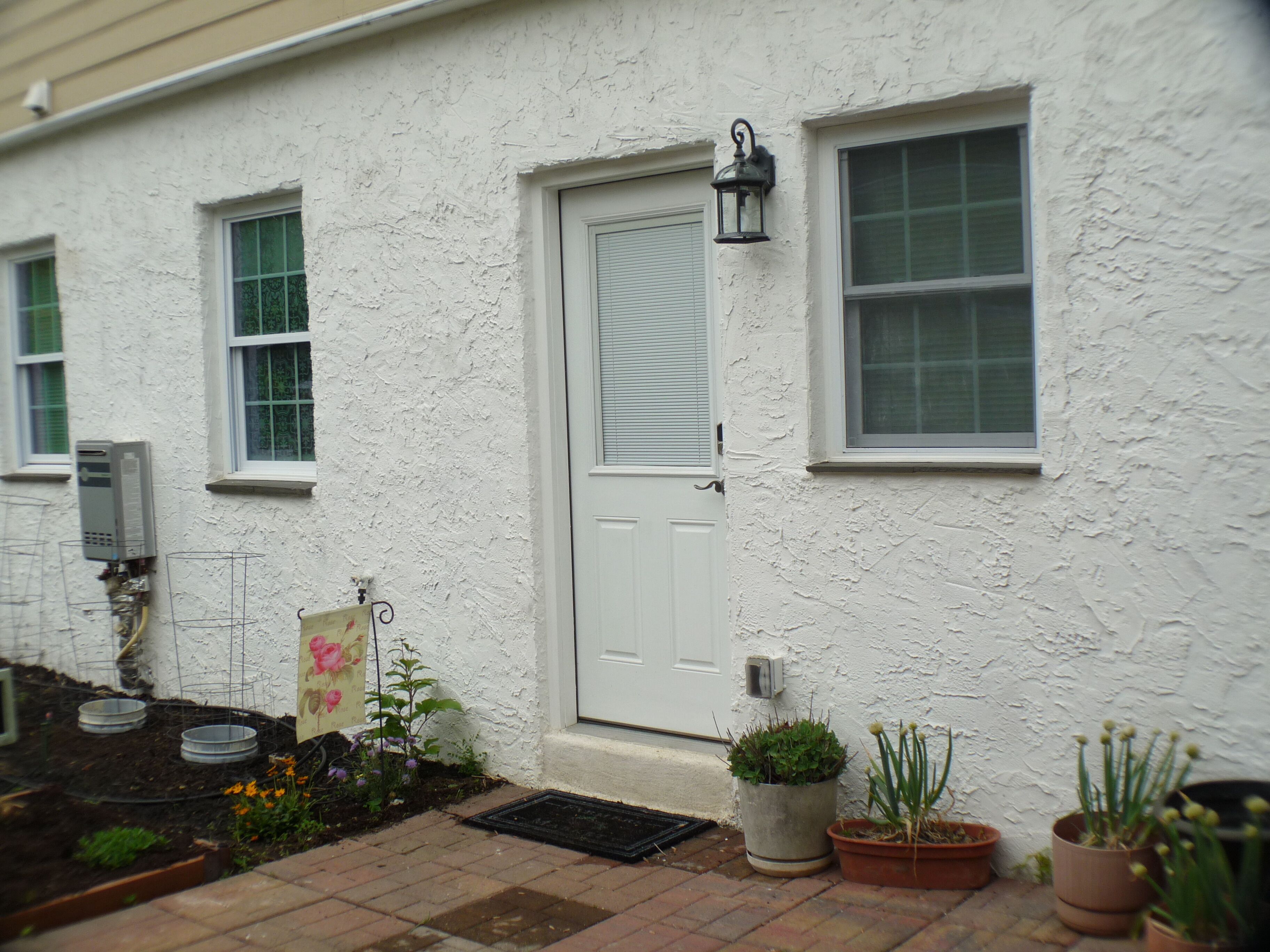 First-Floor Apartment entrance.  No stairs to climb.  Nice little garden.  
