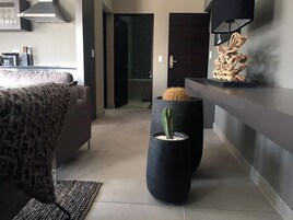 Luxury Apartment, 1 Bedroom, Partial Ocean View | 1 bedroom, in-room safe, individually decorated, individually furnished