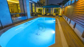Seasonal outdoor pool, pool umbrellas, pool loungers