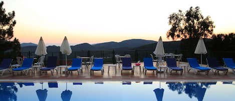 Outdoor pool, pool umbrellas, pool loungers