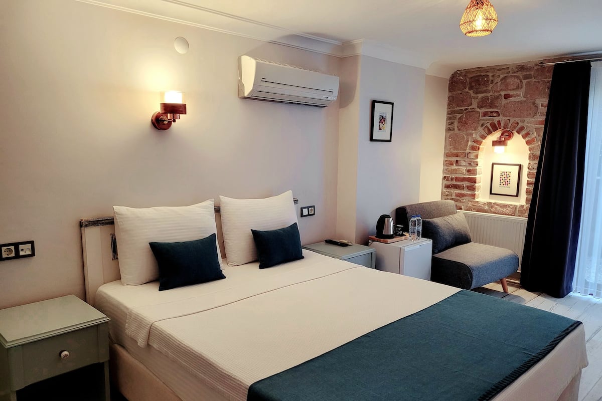 Kamar Double Deluks, pemandangan kebun | Minibar, setrika/meja setrika, dan Wi-Fi gratis
