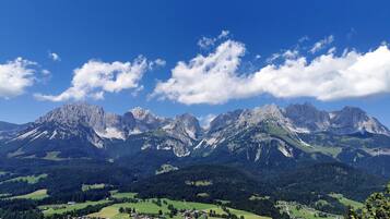 A mountainous landscape with a town in the valley.