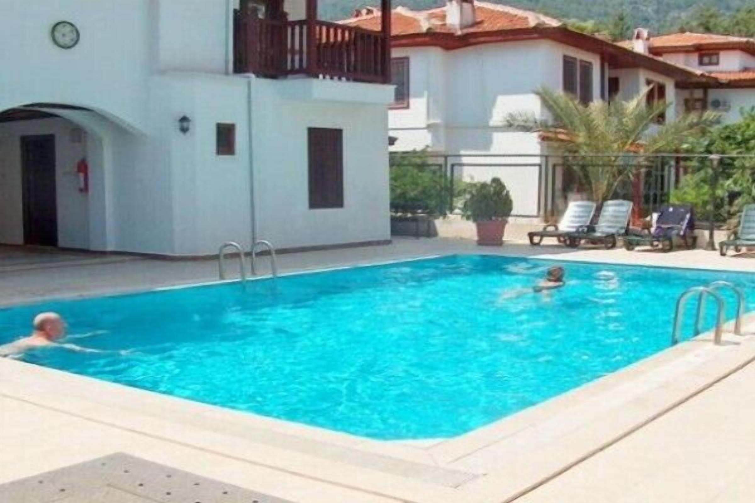 outdoor pool, pool umbrellas, pool loungers