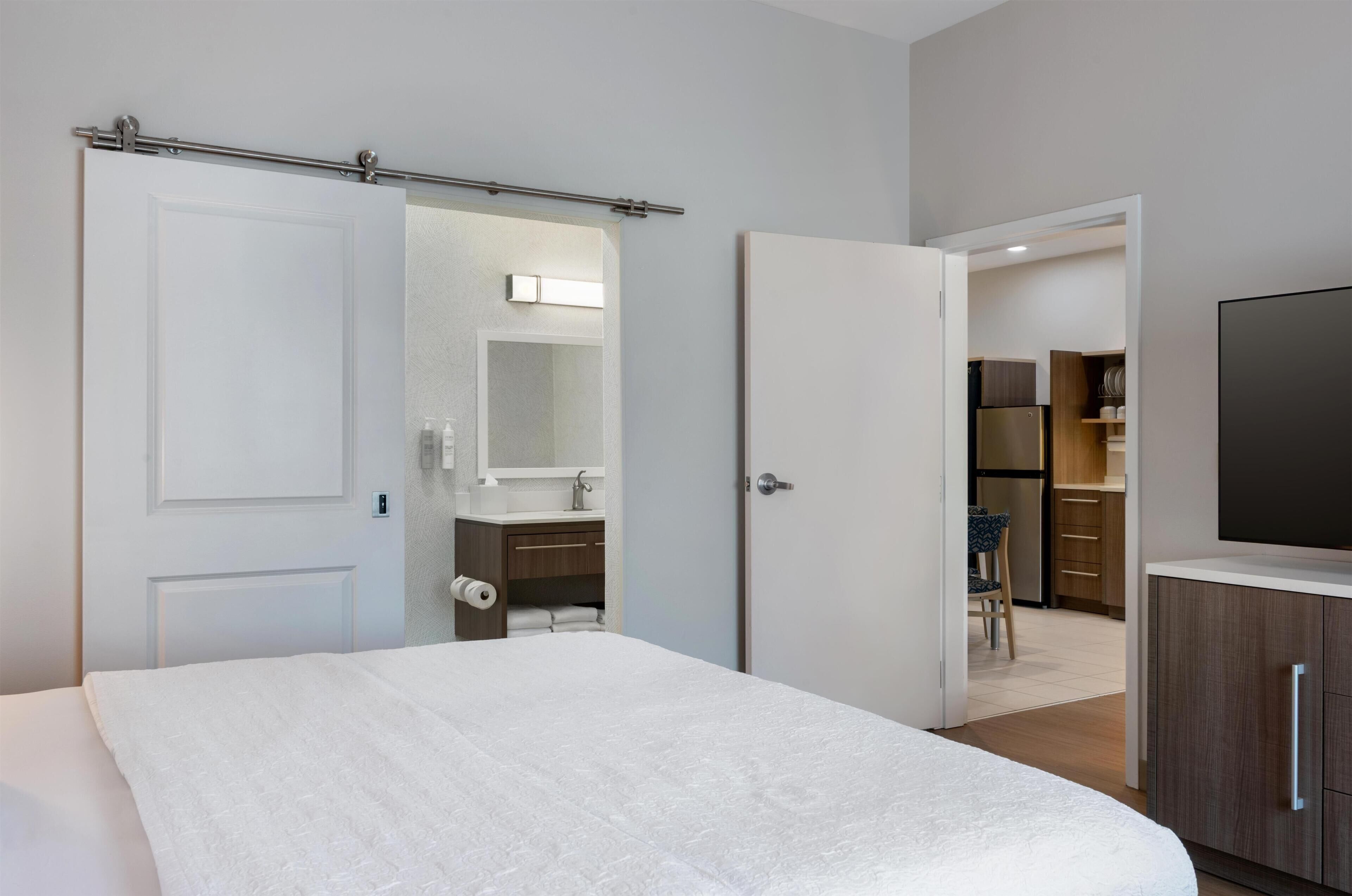 Hypo-allergenic bedding, pillow-top beds, desk, laptop workspace