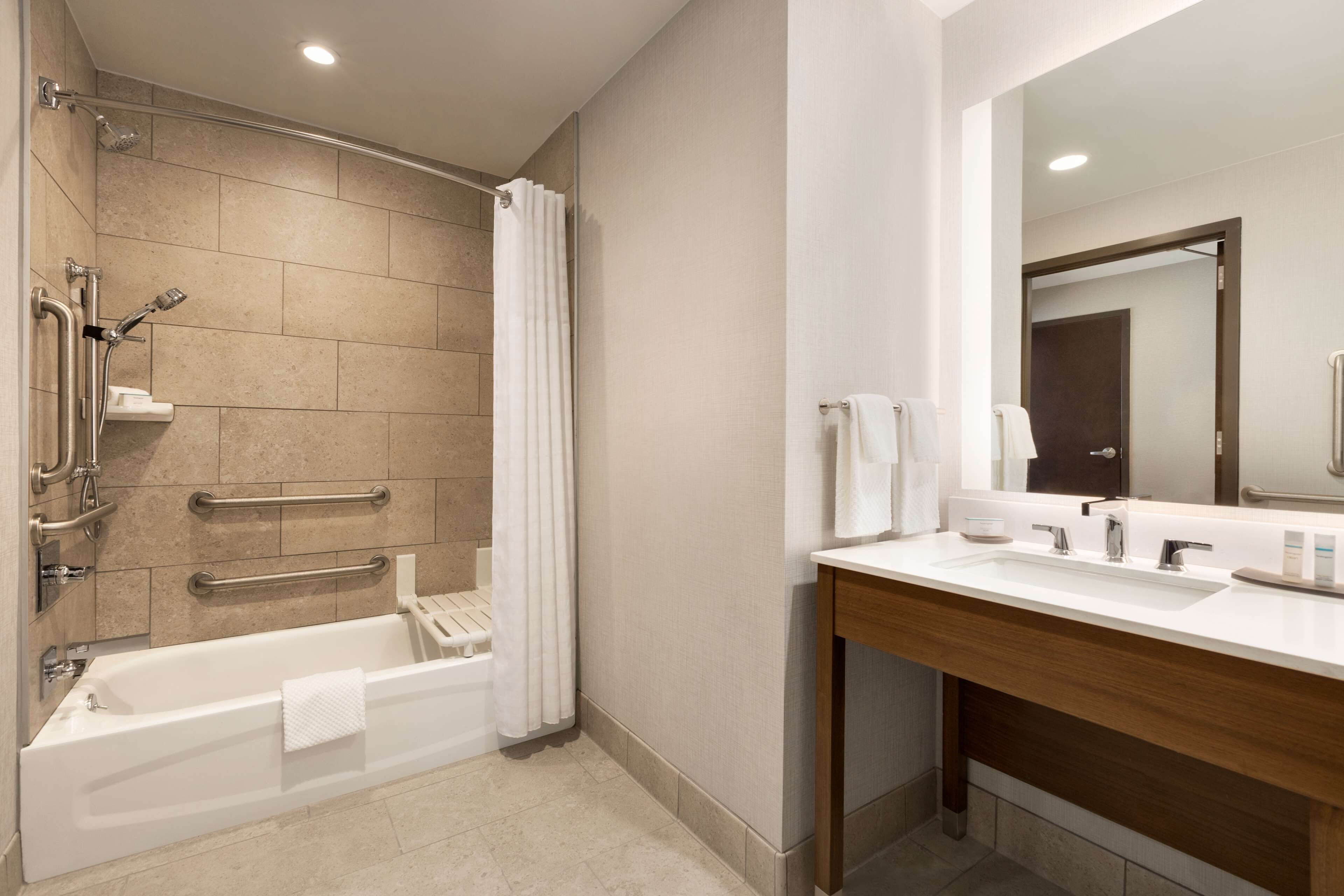 designer toiletries, hair dryer, towels, soap