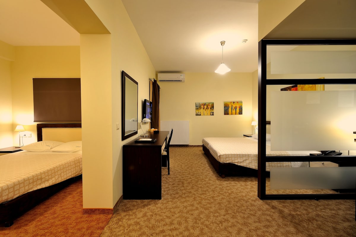 Family Quadruple Room, 2 Bedrooms | Minibar, in-room safe, desk, soundproofing