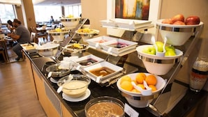 A buffet with various food items and bowls of fruits. - Efeler Hotel (Aydin)