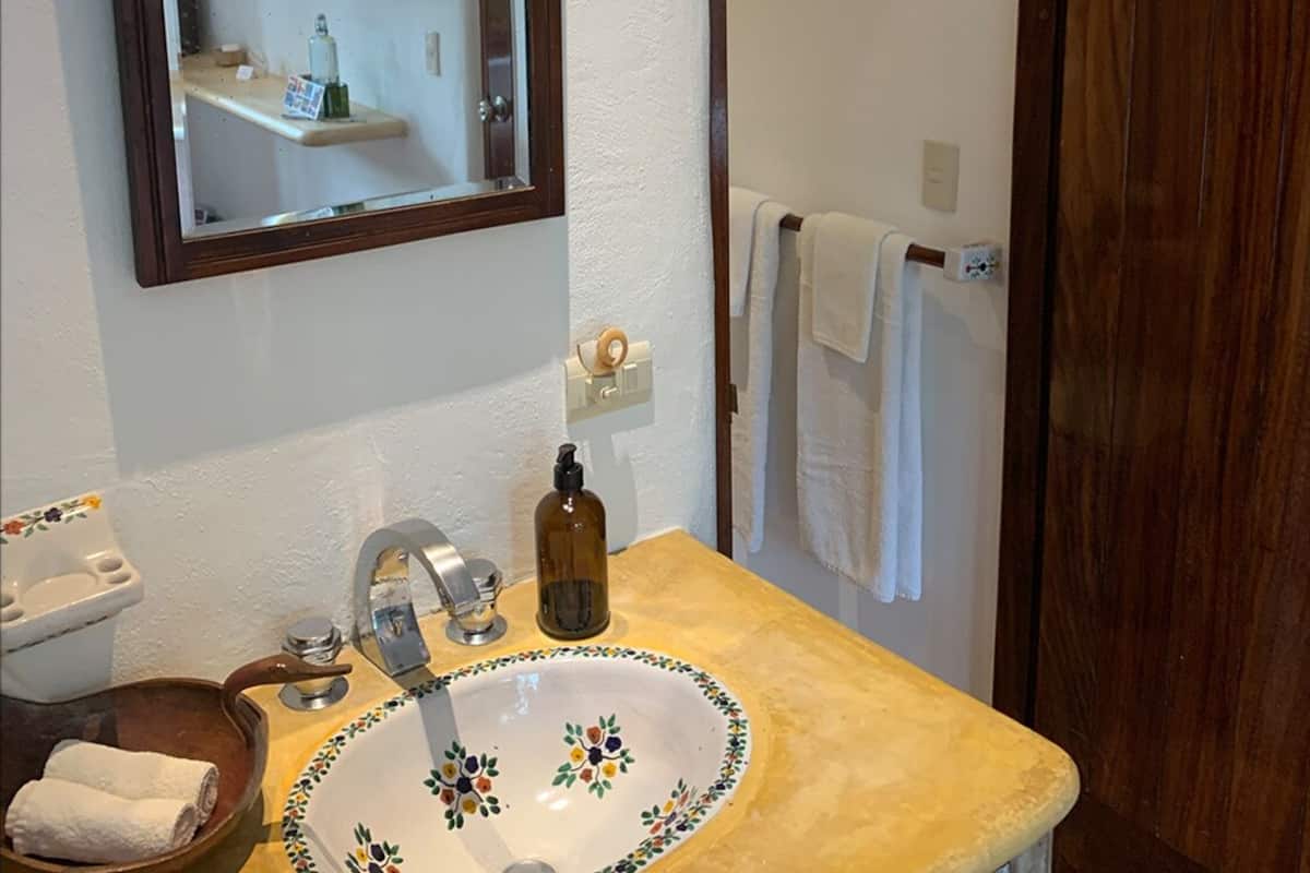 classic double room single use, 1 queen bed, private bathroom, ground floor | bathroom | shower, hair dryer, bathrobes, towels