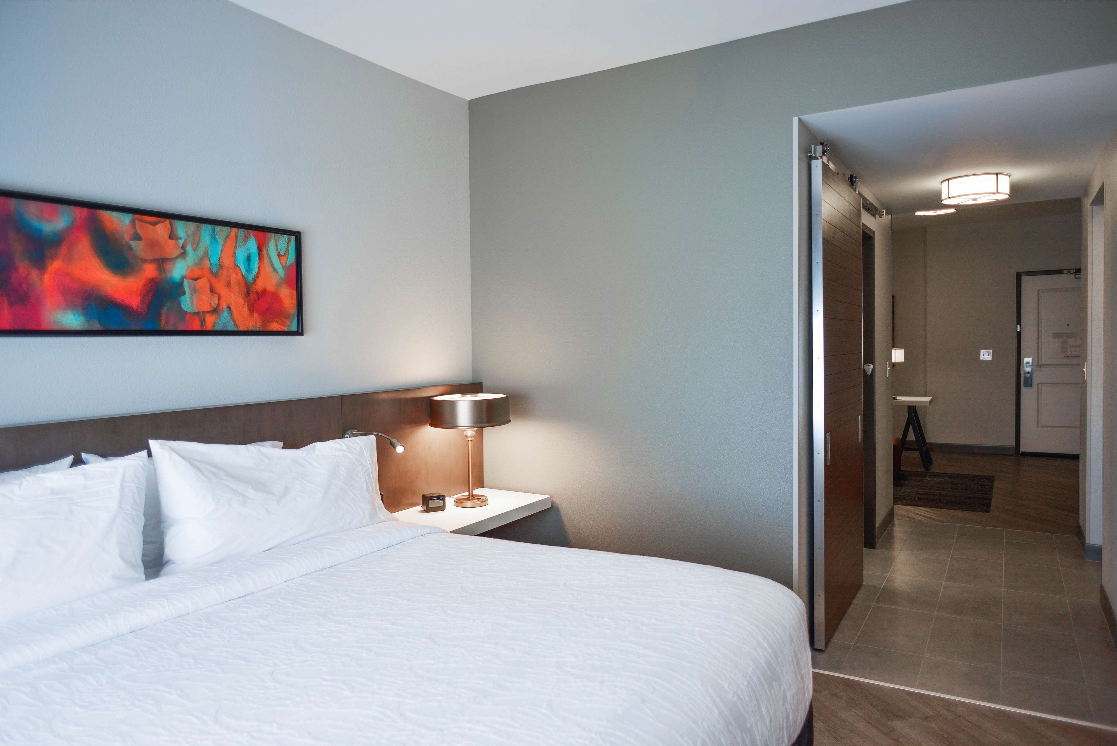 Desk, laptop workspace, blackout drapes, iron/ironing board